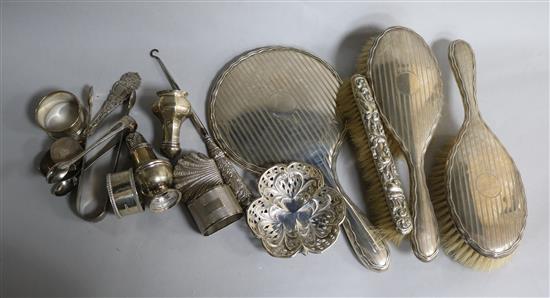 A quantity of assorted silver including mirror, brushes, napkin ring, pepperette etc.